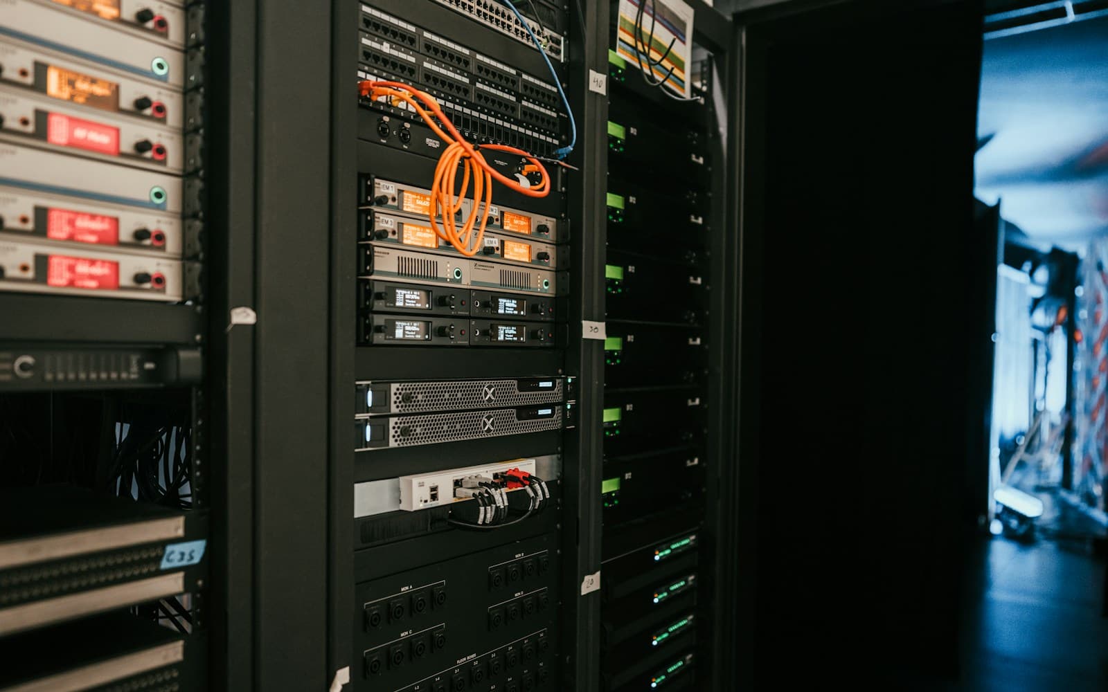 Network server rack illuminated in blue light, evoking AWS data-center infrastructure