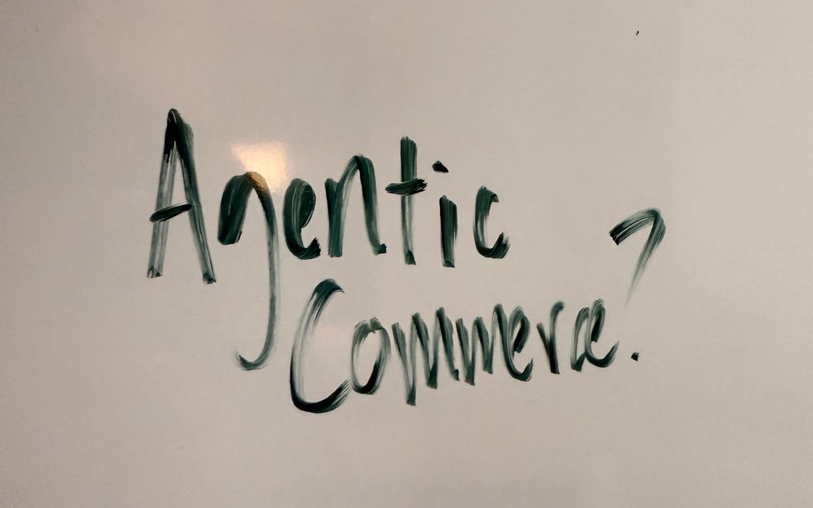 Whiteboard with the words Agentic Commerce? handwritten in marker